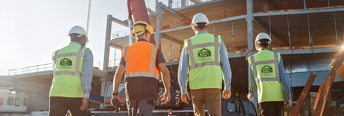 Diverse Team of Specialists Inspect Commercial, Industrial Building Construction Site. Real Estate Project with Civil Engineer, Investor and Worker. In the Background Crane, Skyscraper Formwork Frames